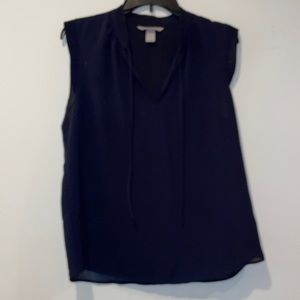 Dotted navy sleeveless blouse tie neck